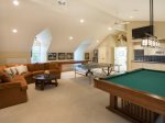 Ping pong table, pool table, and kitchenette in the game room.